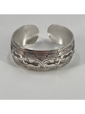 Silver tone floral design cuff bracelet